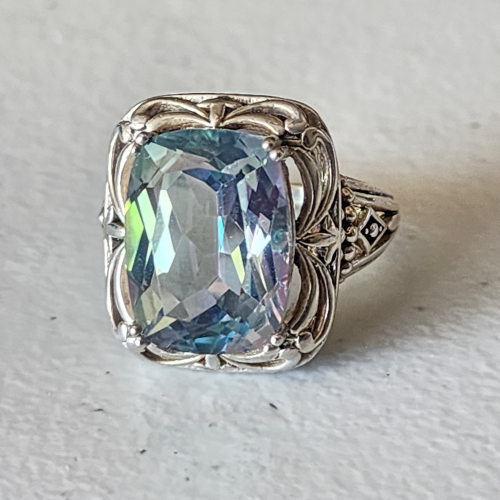 Intricate Silver Ring with Blue Gemstone